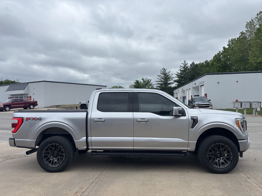 Ford F-150 FX4 with tinted windows outside the shop